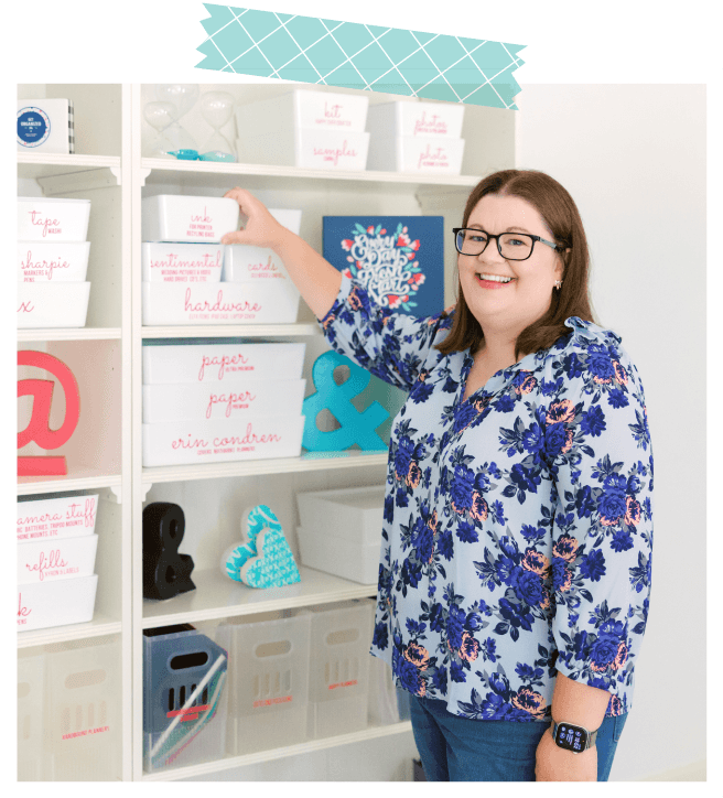 Laura smiling and grabbing a bin off an organized shelf