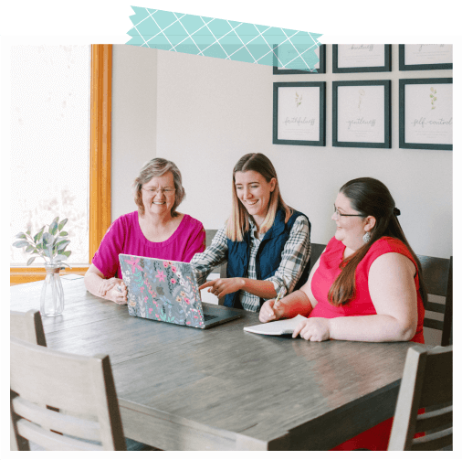 Women of various ages looking at a computer screen